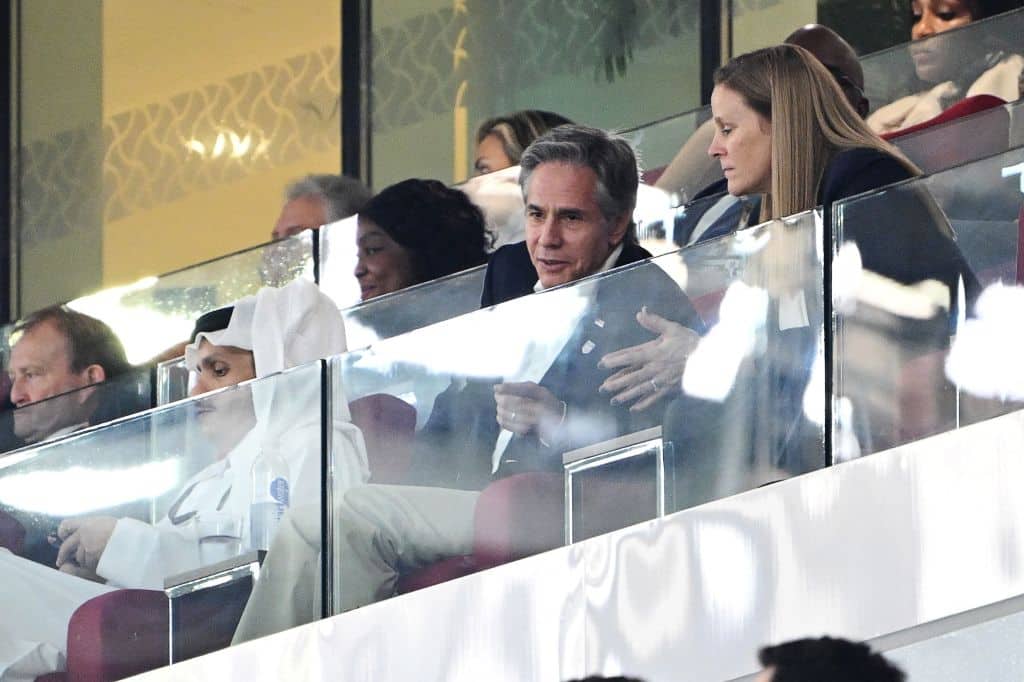 US Secretary of State Antony Blinken (C) watches the Qatar 2022 World Cup Group B football match between USA and Wales at the Ahmad Bin Ali Stadium in Al-Rayyan, west of Doha on November 21, 2022. (Photo by Patrick T. FALLON / AFP) (Photo by PATRICK T. FALLON/AFP via Getty Images)
