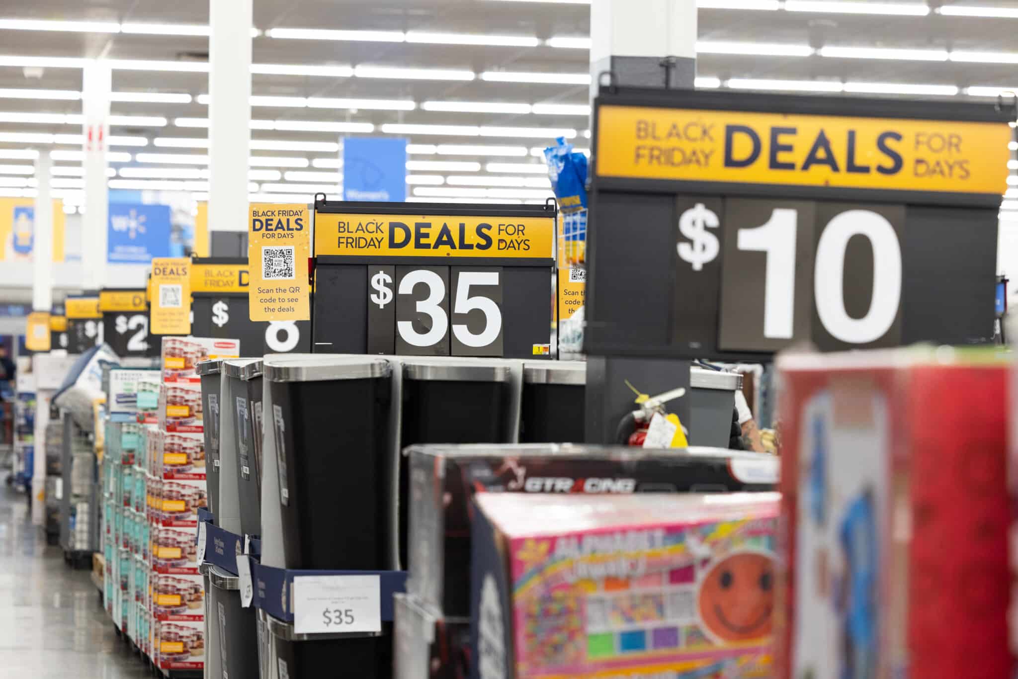 DUNWOODY, GA - NOVEMBER 25: Shoppers walk the aisles of Wal-Mart for Black Friday deals on November 25, 2022 in Dunwoody, Georgia. Walmart opened at 6am on Black Friday for shoppers. (Photo by Jessica McGowan/Getty Images)