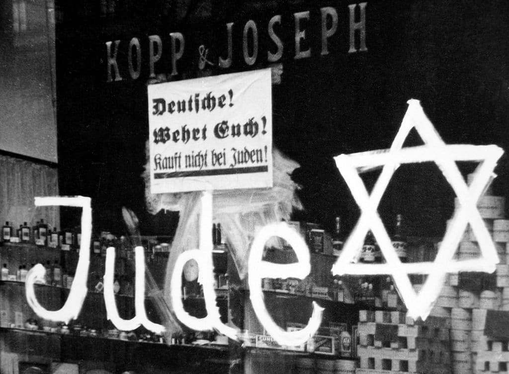 Germany: A Jewish-owned shop vandalized by Nazis with poster reading 'Germans Defend Yourselves - Don't Buy from Jews', 1938. (Photo by: Pictures from History/Universal Images Group via Getty Images)