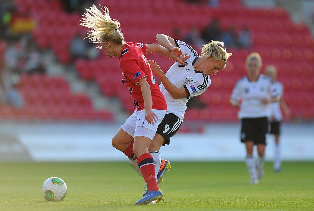 LLANELLI, WALES - AUGUST 19:  Germany forward Pauline Bremer (r) challenges Norway defender Mali Lilleas Naess during the UEFA Women's U19 Tournament Group B match between Germany U19 Women v Norway U19 Women at Parc y Scarlets on August 19, 2013 in Llanelli, Wales.  (Photo by Stu Forster/Getty Images)