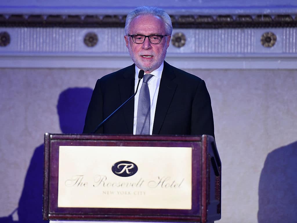 NEW YORK, NY - DECEMBER 01:  Wolf Blitzer speaks onstage at the 2016 AJHS Emma Lazarus Statue Of Liberty Award Dinner - Inside at The Roosevelt Hotel on December 1, 2016 in New York City.  (Photo by Dave Kotinsky/Getty Images)