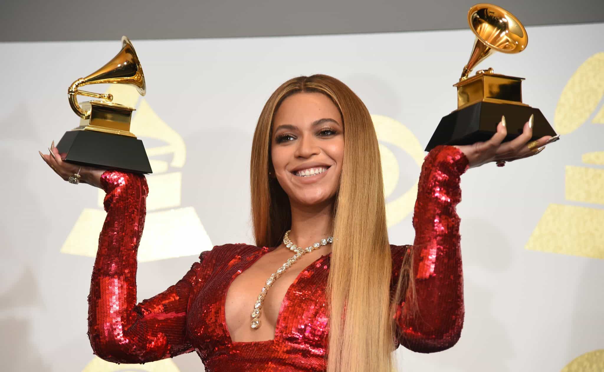 Singer Beyonce poses with her Grammy trophies in the press room during the 59th Annual Grammy music Awards on February 12, 2017, in Los Angeles, California.  / AFP / Robyn BECK        (Photo credit should read ROBYN BECK/AFP via Getty Images)