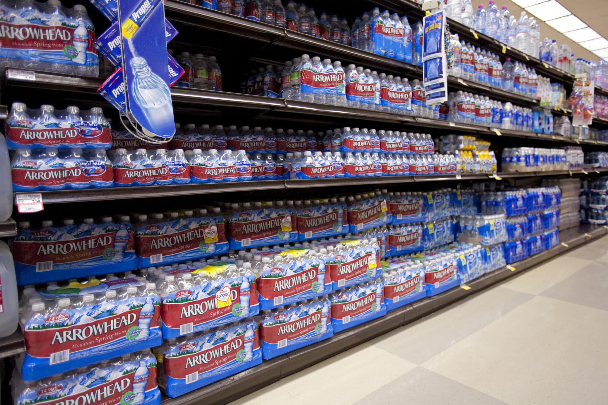 Plastic Water bottles on Supermarket shelf. (Photo by: Education Images/Citizens of the Planet/Universal Images Group via Getty Images)
