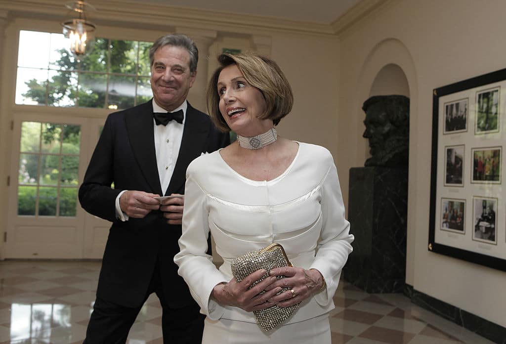 House Minority Leader Nancy Pelosi, with her husband Paul, arrives at a State Dinner for German Chancellor Angela Merkel at the White House in Washington, DC on June 7, 2011. AFP PHOTO/YURI GRIPAS (Photo credit should read YURI GRIPAS/AFP via Getty Images)
