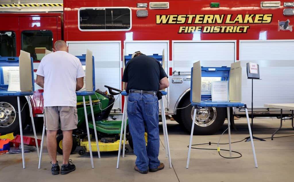 OCONOMOWOC, WISCONSIN - AUGUST 09: Voters cast their ballots at a polling place at the Western Lakes fire station  on August 09, 2022 in Oconomowoc, Wisconsin. Wisconsin is holding its primary election today.  (Photo by Scott Olson/Getty Images)