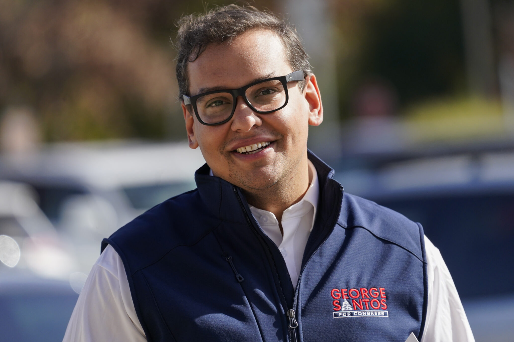 Republican candidate for New York's 3rd Congressional District George Santos campaigns outside a Stop and Shop store, Saturday, Nov. 5, 2022, in Glen Cove, N.Y. (AP Photo/Mary Altaffer)