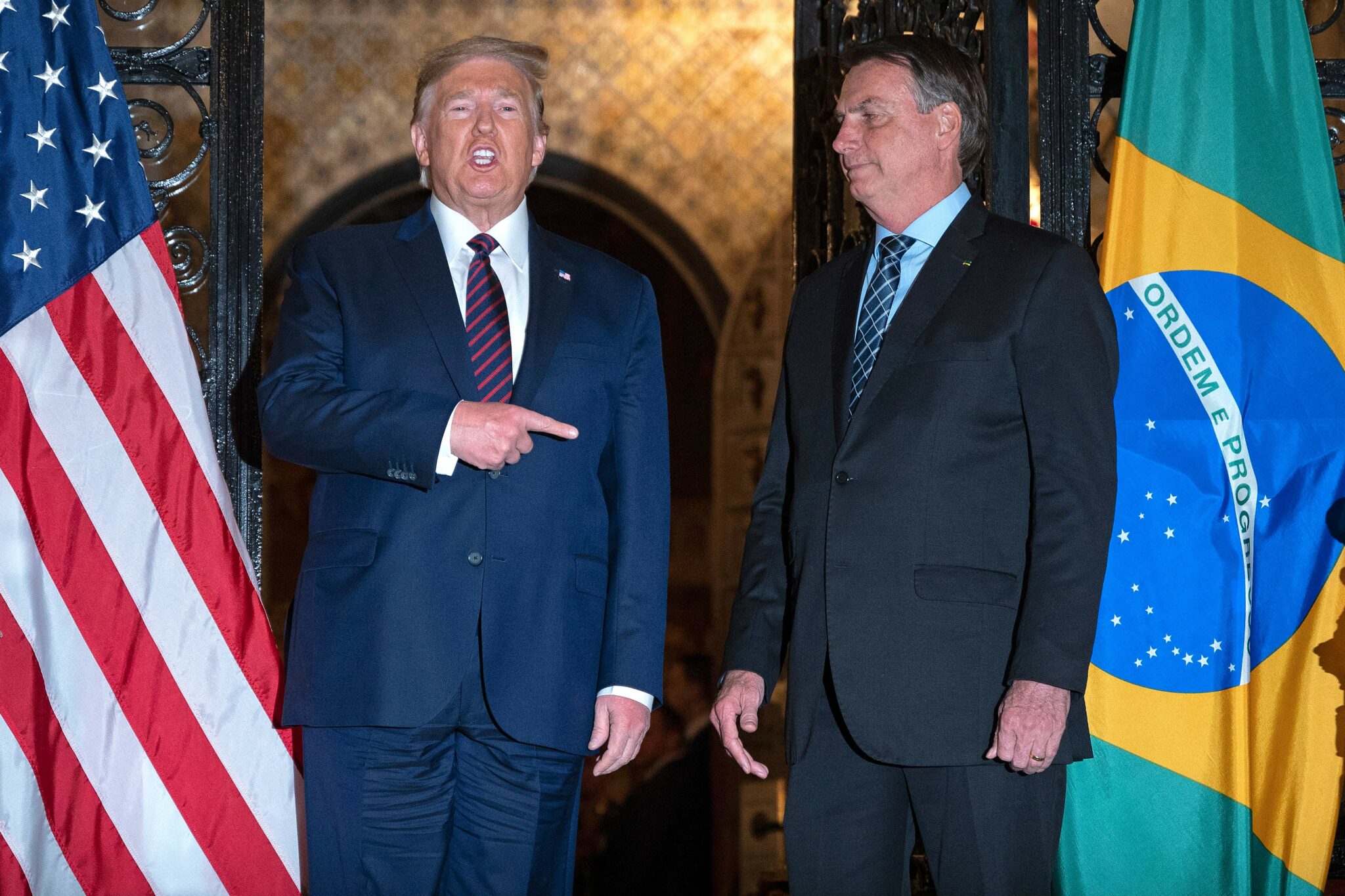 US President Donald Trump (L) speaks with Brazilian President Jair Bolsonaro during a dinner at Mar-a-Lago in Palm Beach, Florida, on March 7, 2020. (Photo by JIM WATSON / AFP) (Photo by JIM WATSON/AFP via Getty Images)