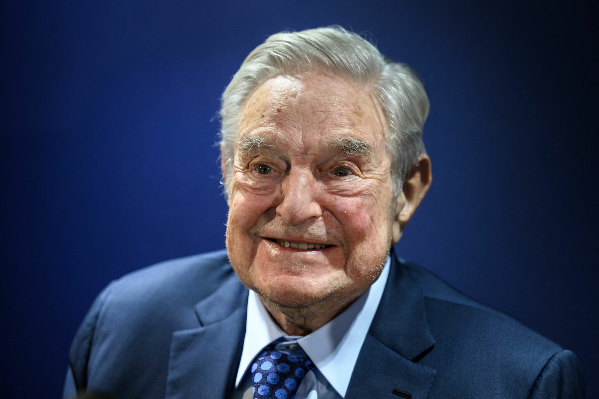 Hungarian-born US investor and philanthropist George Soros smiles after delivering a speech on the sidelines of the World Economic Forum (WEF) annual meeting in Davos on May 24, 2022. (Photo by Fabrice COFFRINI / AFP) (Photo by FABRICE COFFRINI/AFP via Getty Images)