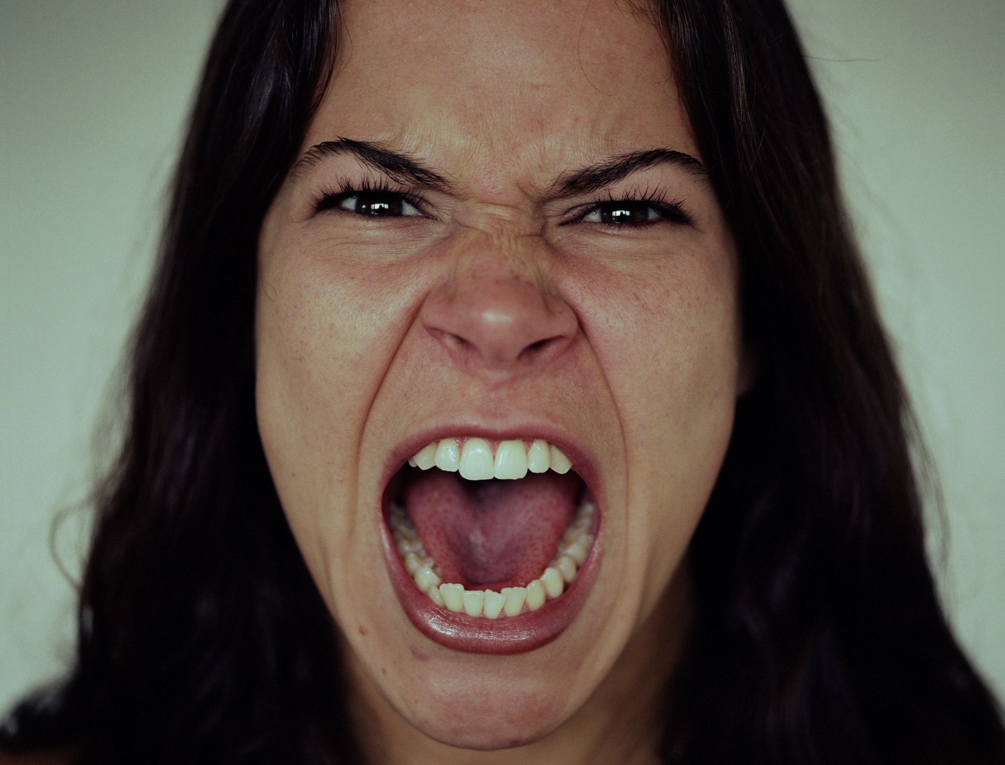 Young woman screaming, close-up