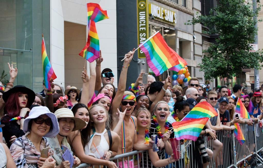 A large group of young people wave pride flags and cheer during the 46th Lesbian, Gay, Bisexual and Transgender Pride March in New York City, New York, June 26, 2016. (Photo via EuropaNewswire/Gado/Getty Images).