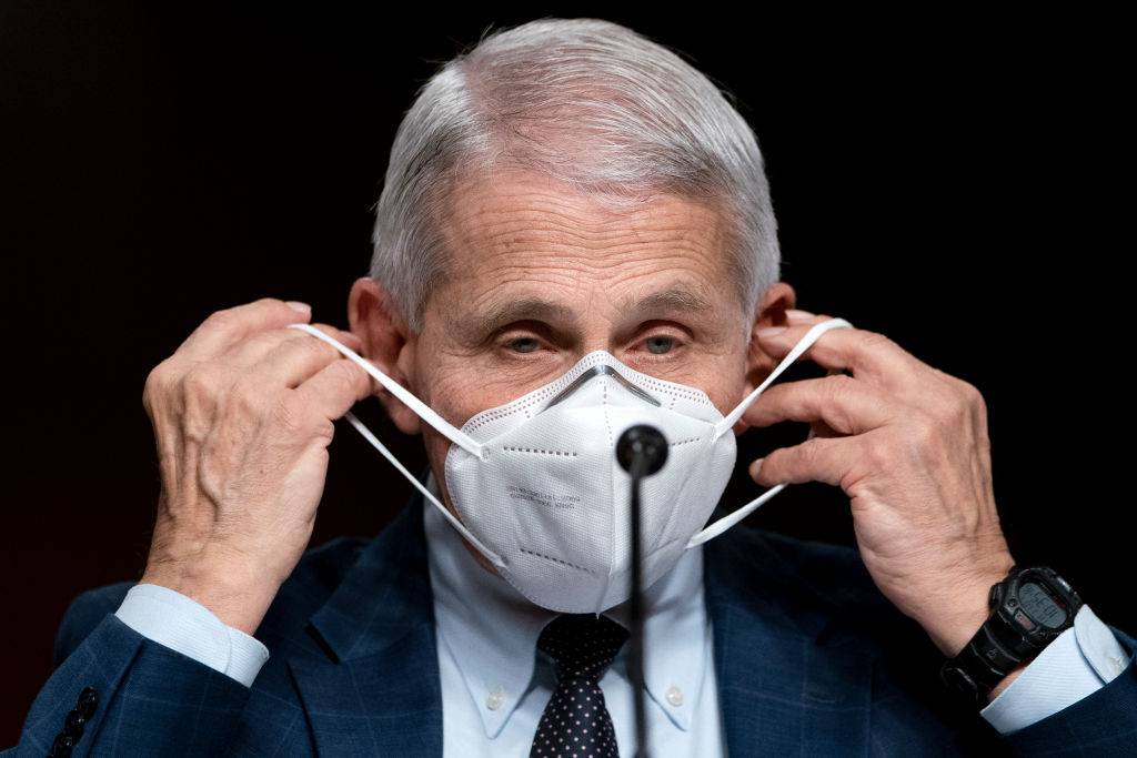 WASHINGTON, DC - JANUARY 11: Dr. Anthony Fauci, White House Chief Medical Advisor and Director of the NIAID, removes his mask to give an opening statement at a Senate Health, Education, Labor, and Pensions Committee hearing on Capitol Hill on January 11, 2022 in Washington, D.C. The committee will hear testimony about the federal response to COVID-19 and new, emerging variants. (Photo by Greg Nash-Pool/Getty Images)