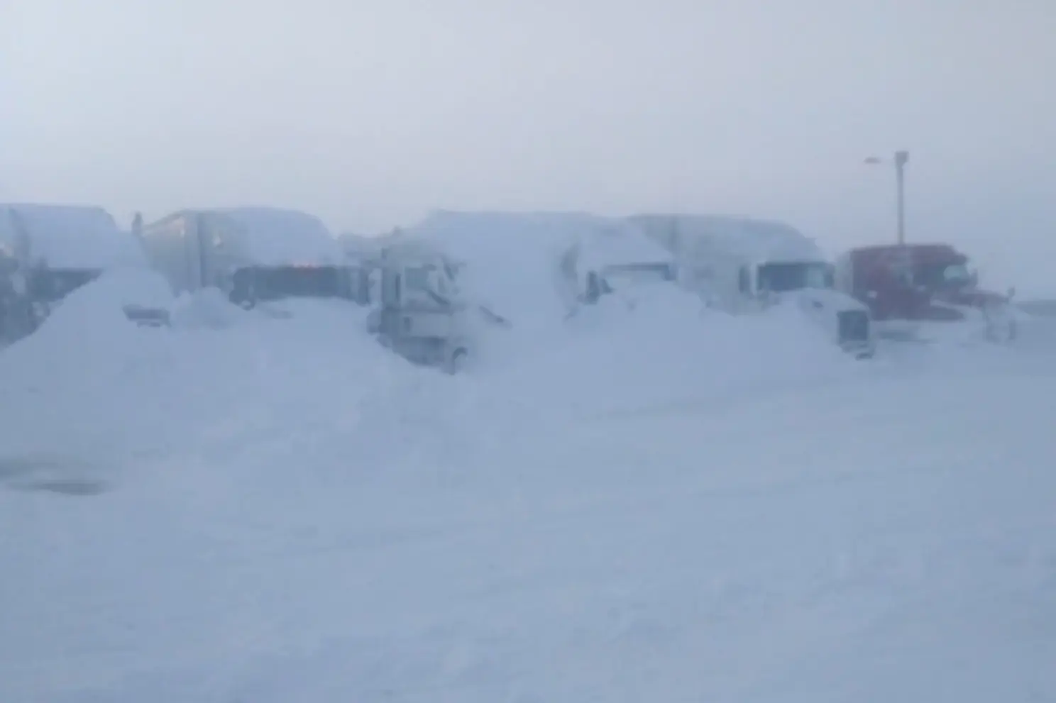 trucks-buried-snow-south-dakota-02