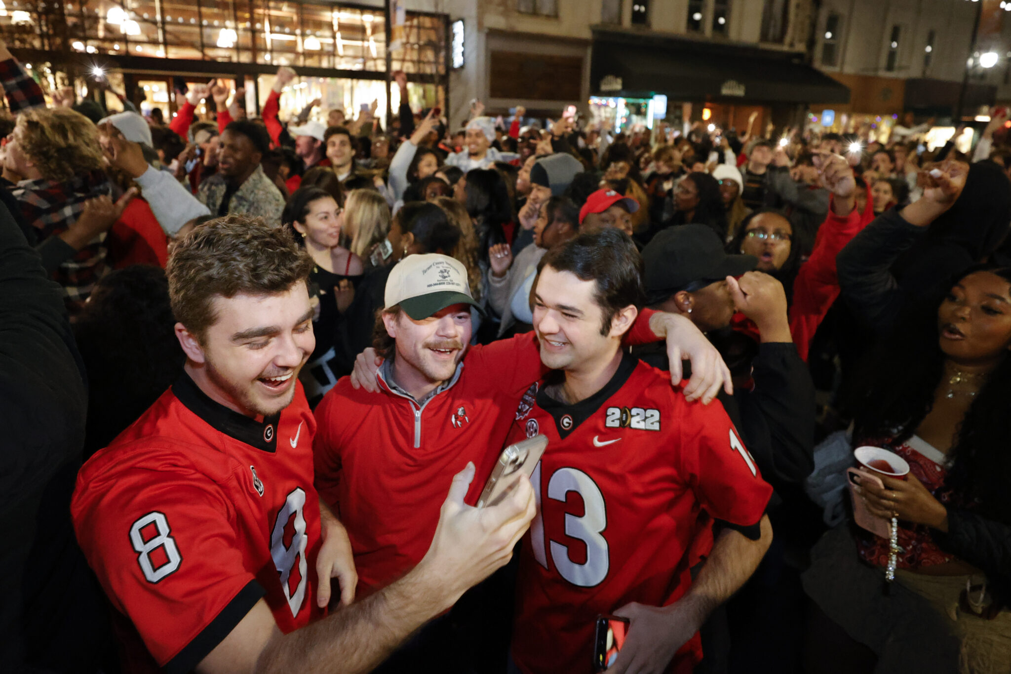 University of Georgia students celebrate in the streets after the College Football Playoff national championship game against TCU, Monday, Jan. 9, 2023, in Athens, Ga. (AP Photo/Alex Slitz)