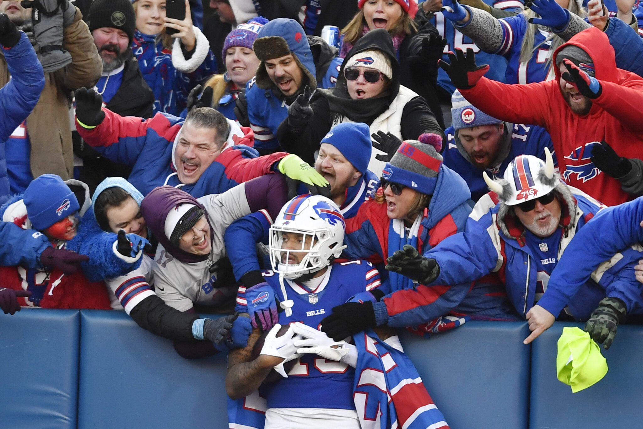 Buffalo Bills wide receiver Gabe Davis (13) is congratulated by fans after his touchdown during the second half of an NFL wild-card playoff football game against the Miami Dolphins, Sunday, Jan. 15, 2023, in Orchard Park, N.Y. (AP Photo/Adrian Kraus)