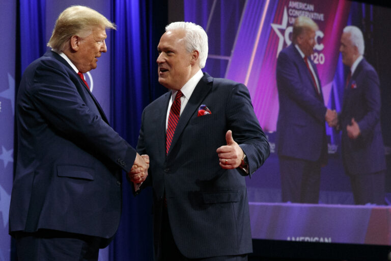 FILE - In this Feb. 29, 2020, file photo, President Donald Trump is greeted by Matt Schlapp, Chairman of the American Conservative Union, as the president arrives to speak at the Conservative Political Action Conference,  at National Harbor, in Oxon Hill, Md. Republican political operatives are recruiting “pro-Trump” doctors to go on television to prescribe reviving the U.S. economy as quickly as possible, without waiting to meet the COVID-19 safety benchmarks proposed by public health experts. The plan was discussed in a May 11 conference call with a senior staffer for the Trump re-election campaign. “The president’s going to get tagged by the fake news media as being irresponsible and not listening to doctors,” Schlapp said on the call. “And so we have to gird his loins with a lot of other people. So I think what Nancy’s talking about … this is the critical juncture that we highlight them.”(AP Photo/Jacquelyn Martin, File)