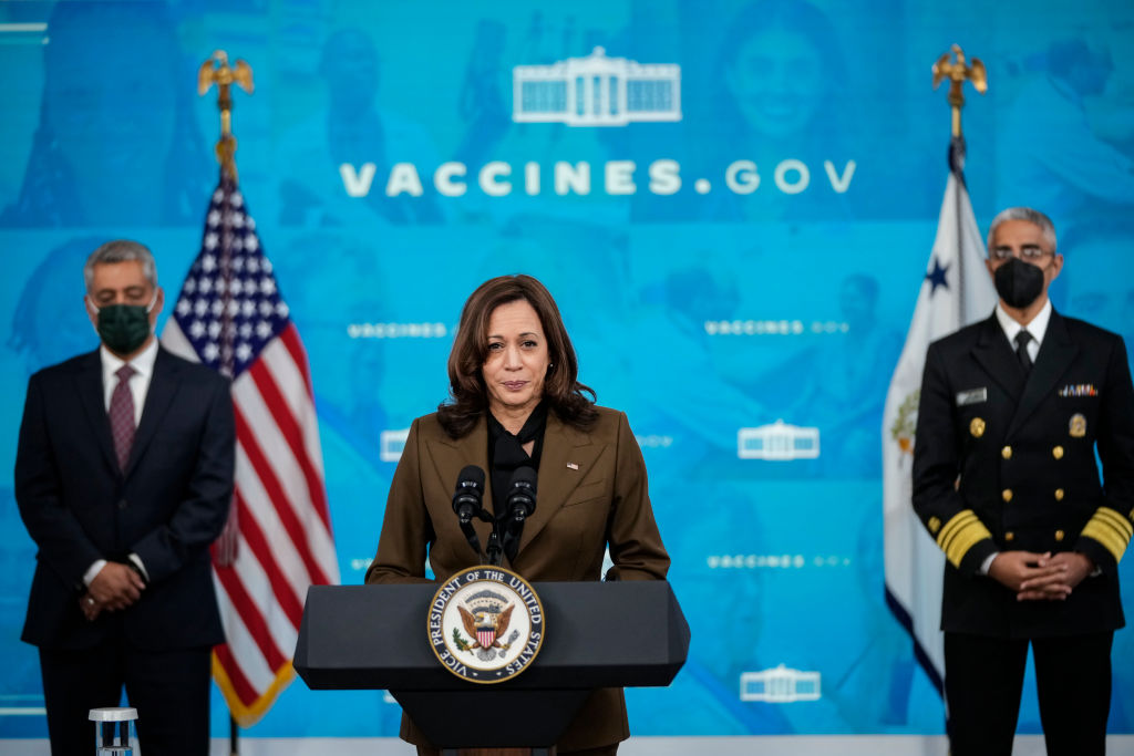 WASHINGTON, DC - NOVEMBER 22: Flanked by Dr. Luis Padilla (L), associate Administrator for Health Workforce at Health Resources and Services Administration,  and U.S. Surgeon General Dr. Vivek Murthy (R), Vice President Kamala Harris speaks about Covid-19 vaccine equity in the South Court Auditorium at the White House complex November 22, 2021 in Washington, DC.  The White House announced Monday a $1.5 billion initiative aimed at shoring up healthcare access in rural and underserved areas. (Photo by Drew Angerer/Getty Images)