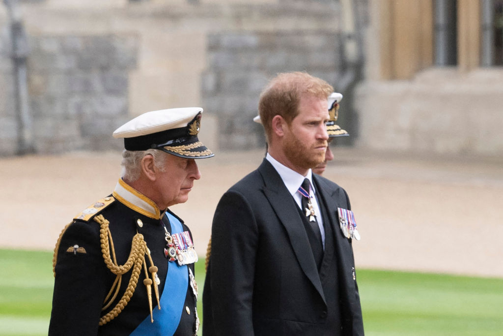 Britain's King Charles III (L) walks with his son Britain's Prince Harry, Duke of Sussex as they arrive at St George's Chapel inside Windsor Castle on September 19, 2022, ahead of the Committal Service for Britain's Queen Elizabeth II. - Monday's committal service is expected to be attended by at least 800 people, most of whom will not have been at the earlier State Funeral at Westminster Abbey. (Photo by David Rose / POOL / AFP) (Photo by DAVID ROSE/POOL/AFP via Getty Images)