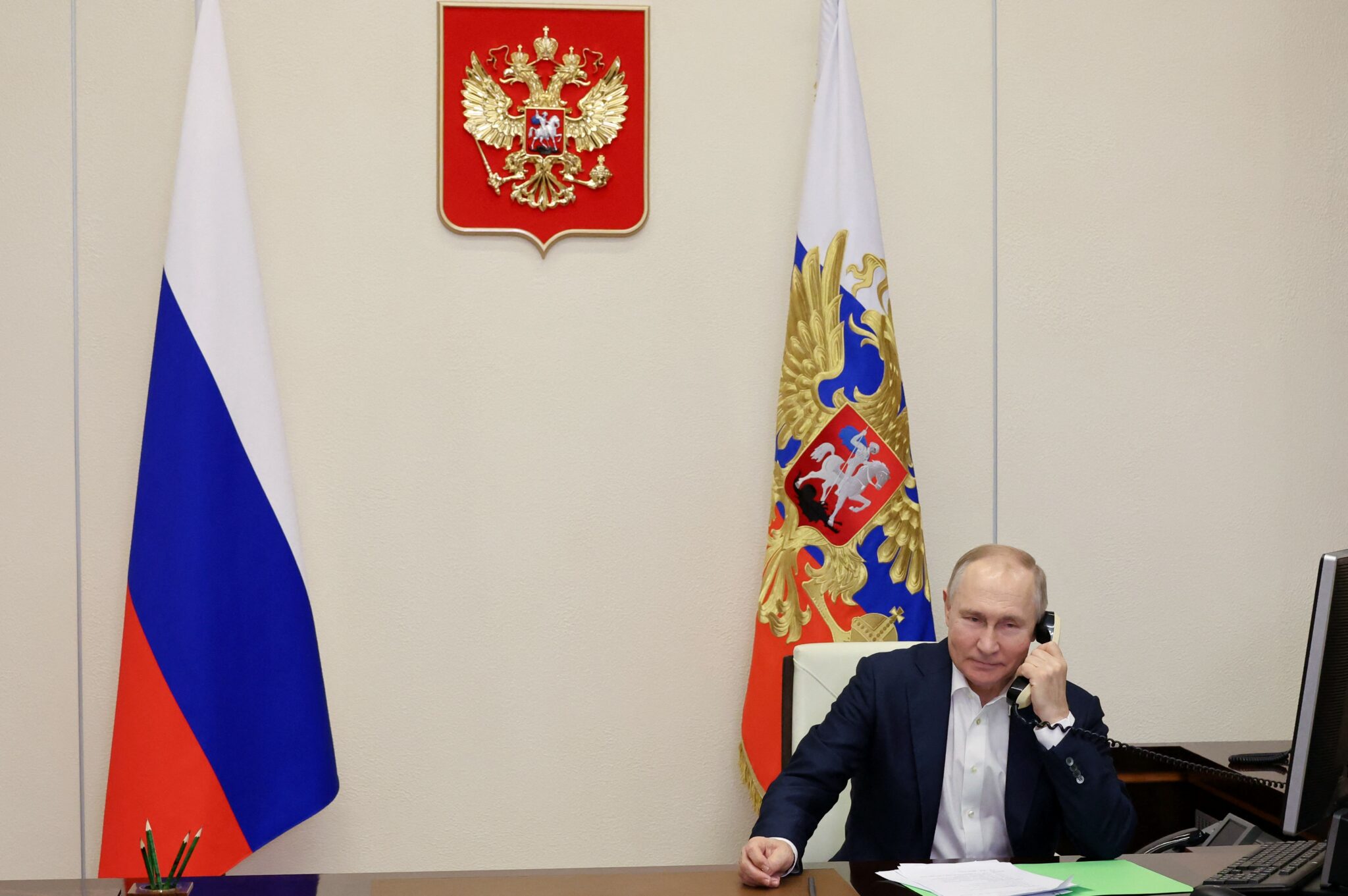 TOPSHOT - Russian President Vladimir Putin talks on the phone with Agatha Bylkova,a eight-year-old  girl from the Kurgan region who took part in the New Year Tree of Wishes nationwide charity campaign, in Moscow on January 3, 2023. (Photo by MIKHAIL KLIMENTYEV / SPUTNIK / AFP) (Photo by MIKHAIL KLIMENTYEV/SPUTNIK/AFP via Getty Images)