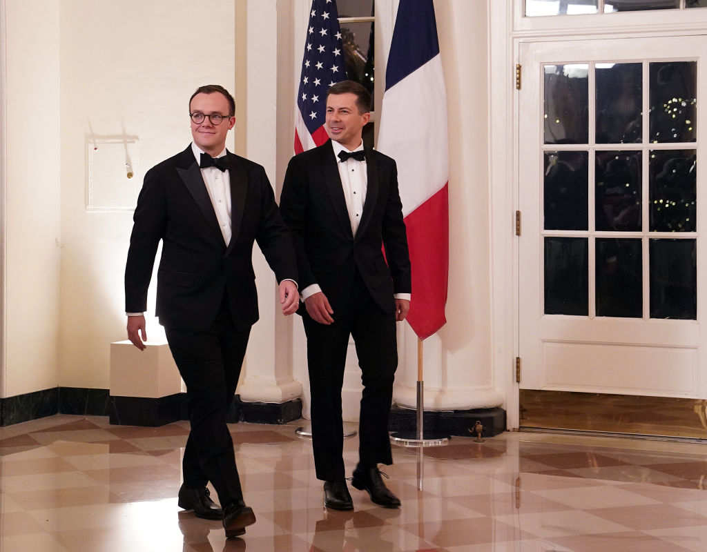 WASHINGTON, DC - DECEMBER 01: U.S. Transportation Secretary Pete Buttigieg (R) and his husband Chasten Buttigieg arrive for the White House state dinner for French President Emmanuel Macron at the White House on December 1, 2022 in Washington, DC. The official state visit is the first for the Biden administration.  (Photo by Nathan Howard/Getty Images)