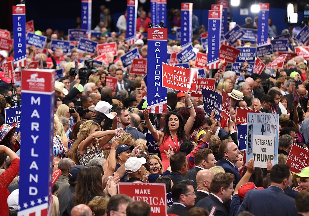 Delgates and signs crowd the floor  of the Republican National Convention at Quicken Loans Arena in Cleveland, Ohio, July 21, 2016. / AFP / Robyn BECK        (Photo credit should read ROBYN BECK/AFP via Getty Images)