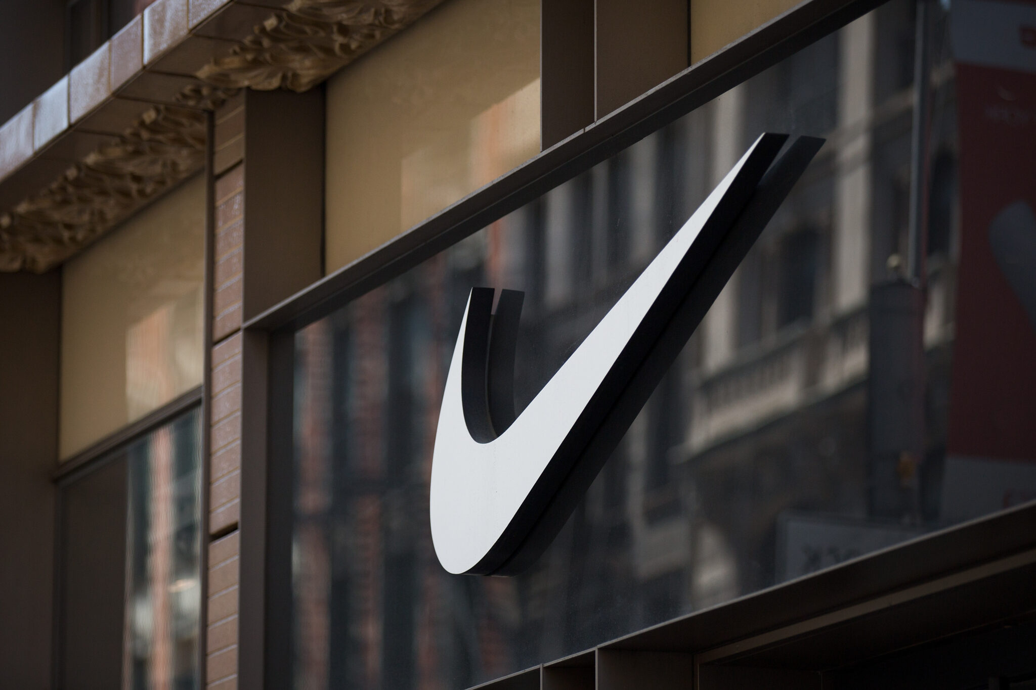 NEW YORK, NY - JUNE 15: The Nike 'swoosh' logo is displayed on the outside of the Nike SoHo store, June 15, 2017 in New York City. Nike announced plans on Thursday to cut about 2 percent of its global workforce. (Photo by Drew Angerer/Getty Images)