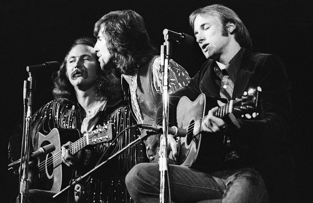DETROIT - JUNE 12:  L-R David Crosby, Graham Nash and Stephen Stills of Crosby, Stills and Nash perform in concert at Olympia Stadium (the chilly former home of the Red Wings) on June 12, 1970 in Detroit, Michigan. (Photo by Tom Copi/Michael Ochs Archive/Getty Images)