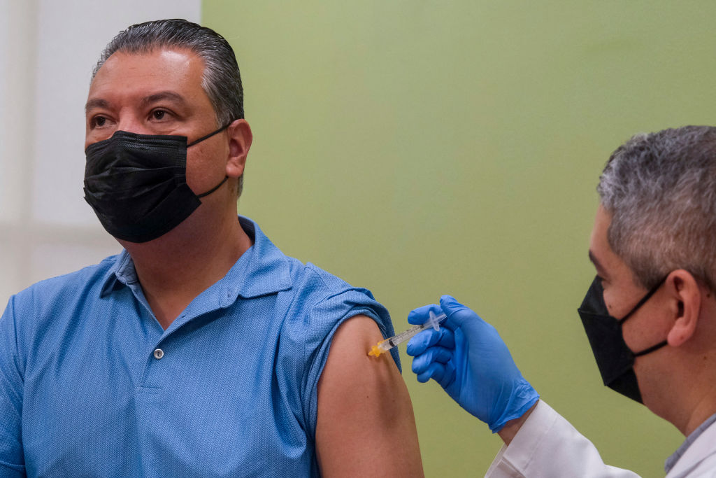 Sen. Alex Padilla (D-CA) receives a Covid-19 booster shot at AltaMed Medical clinic in Los Angeles, California, on October 6, 2022. (Photo by RINGO CHIU / AFP) (Photo by RINGO CHIU/AFP via Getty Images)